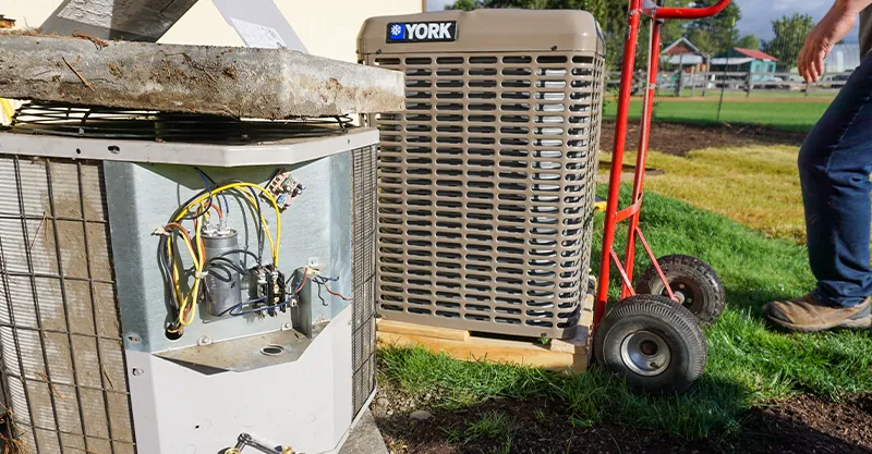 Professional technician installing an air conditioner