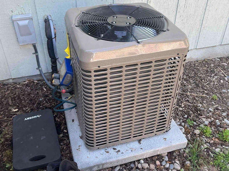 A freshly installed York air conditioner that will make the customer's home cooler and more comfortable.