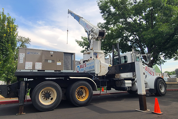 A High effeciency York Heat Pump being unloaded with a crane