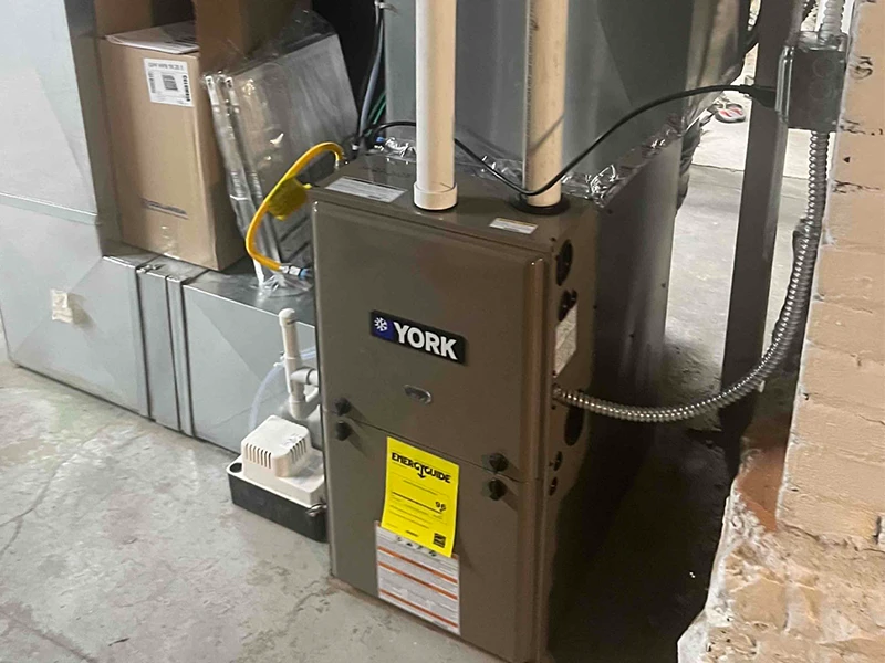 A clean installation of a York TM9E high efficiency furnace by Bills Heating and AC. 